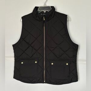 J.Crew woman’s black, quilted, down vest. Full zip, black&white lining. Size XL